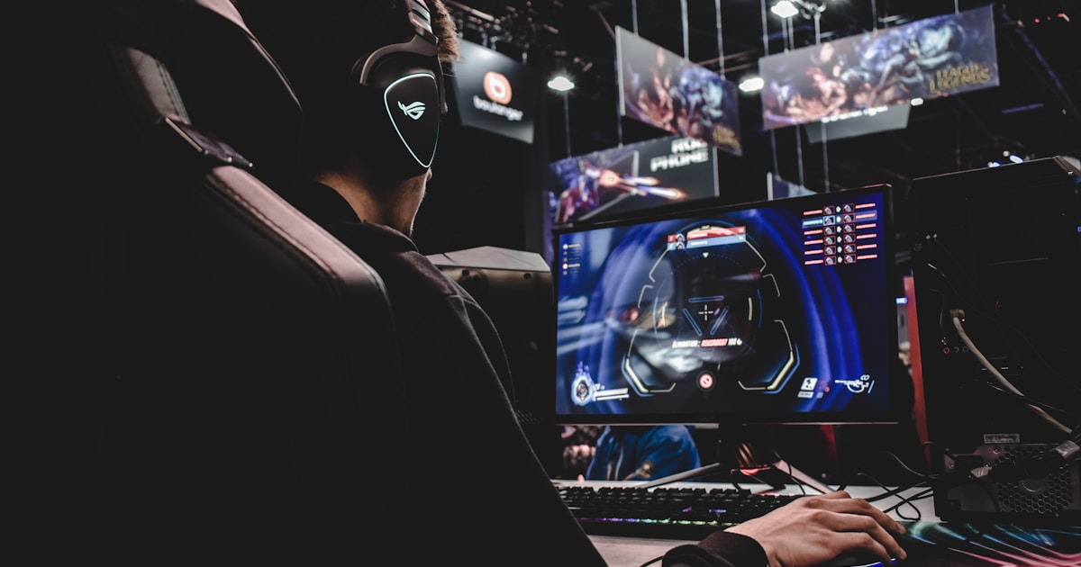 Gamer immersed in a virtual world with glowing screens and controllers
