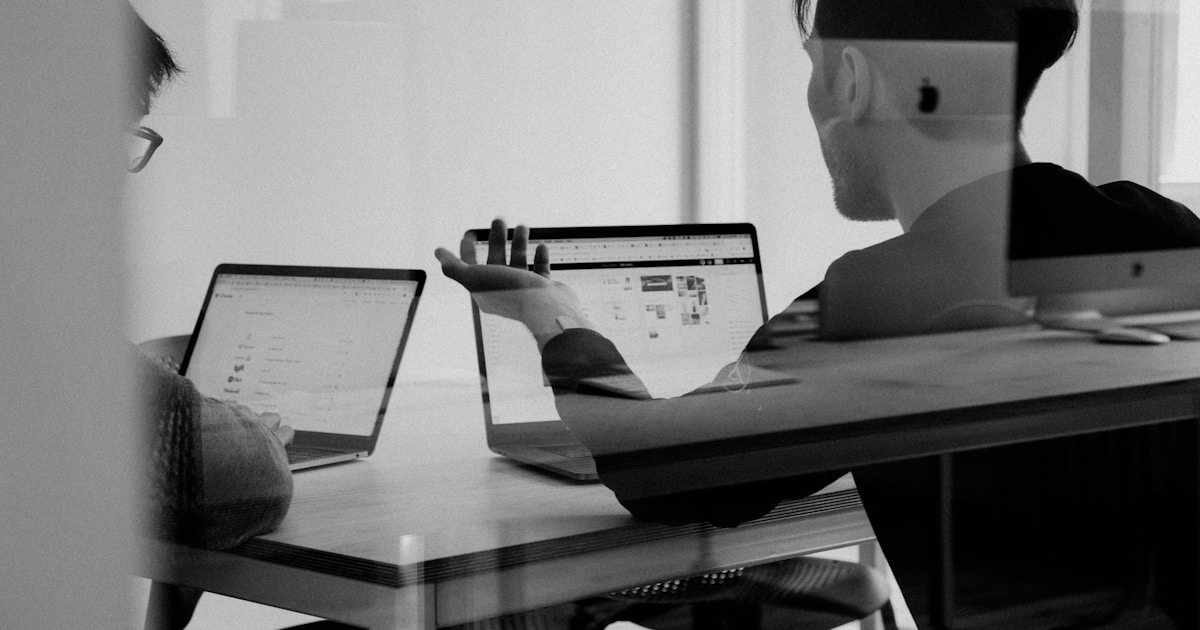Sales team working with digital screens and technology in a modern office