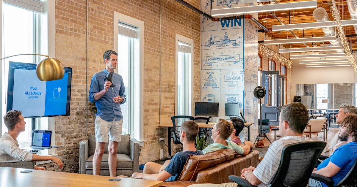 Customer support team working with AI technology in a modern office